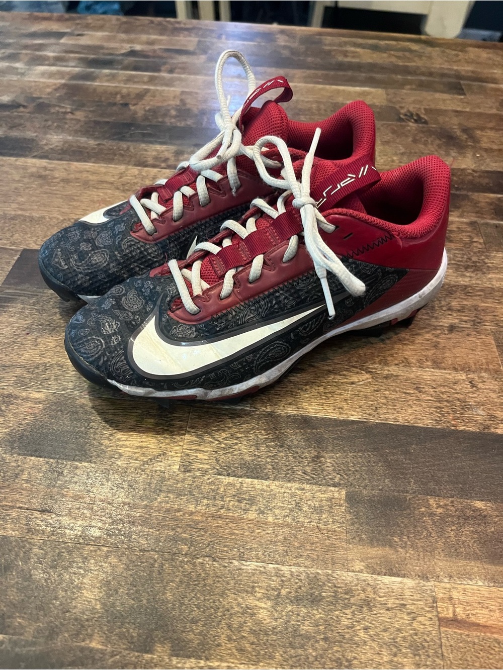 Nike Kids football cleats size 5Y.  Red, Black & White